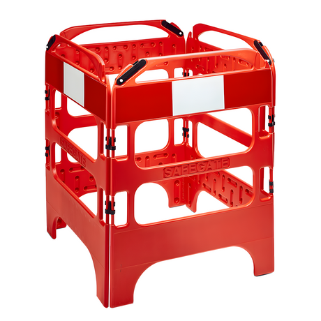 A red four-sided plastic barrier used for construction or safety purposes