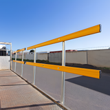 Rendered side view of a flatbed truck with a full-length guardrail installed along its deck.