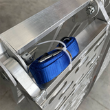 View of a blue safety strap tied securely to the ramp, demonstrating safety features for loading operations