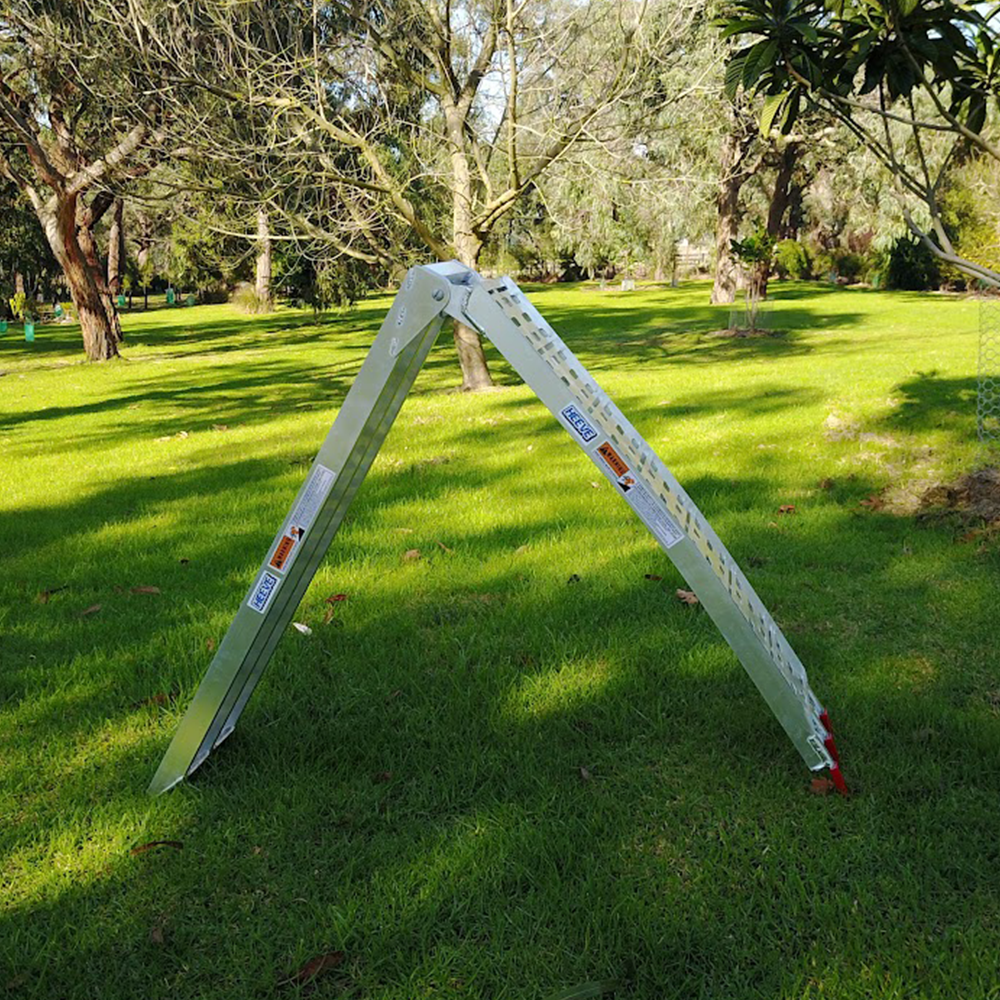 The aluminium ramp set up outdoors in an A-frame position, showcasing its versatility for various applications.