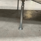 A close-up view of a support leg attached to the ramp, ensuring extra stability on uneven surfaces.