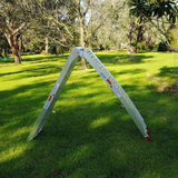 Wide: A ramp set up outdoors, displaying its arch design for better loading capabilities.