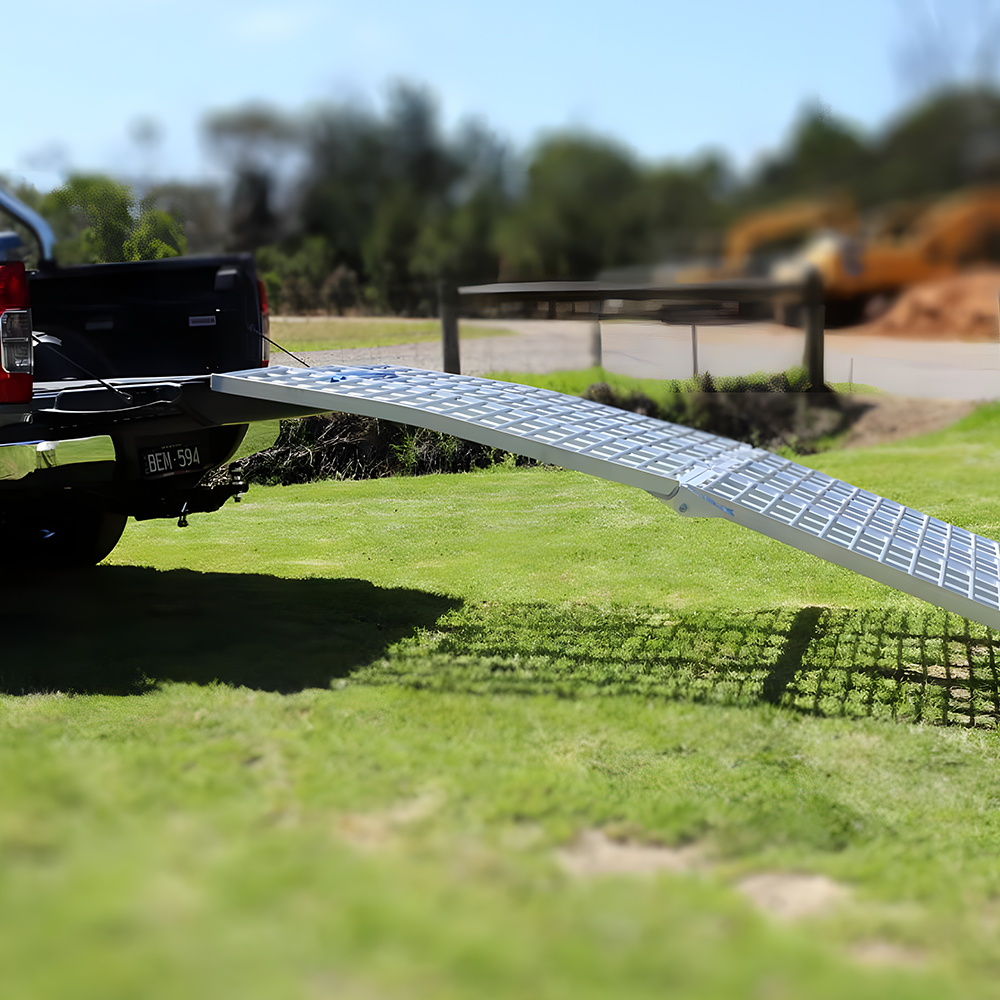 A side angle view of the Heeve ramp, showing its curved design, which helps reduce the risk of vehicles bottoming out during loading