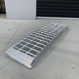 A full image of the Heeve 3m Aluminium Curved Loading Ramp, showing the reinforced, heavy-duty design ready for loading