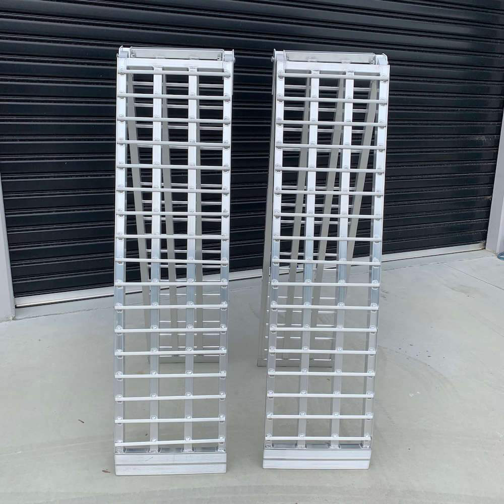  A front-facing view of two Heeve loading ramps with reinforced rungs, showing their durable build and wide load-bearing surface.