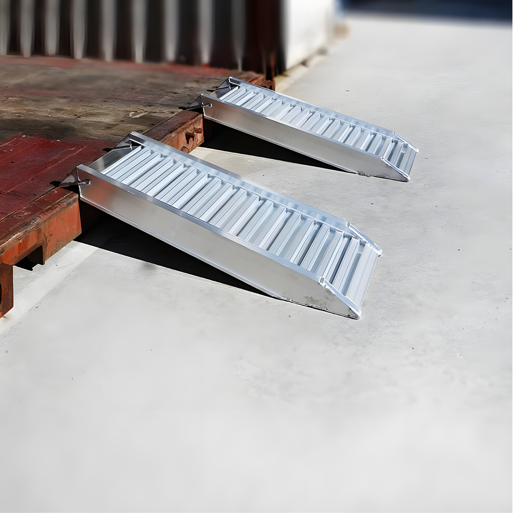 Side view of two Heeve aluminium loading ramps, securely placed on a platform, showcasing their raised sides for stability and safety.