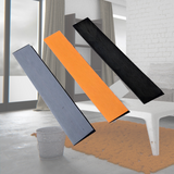 Three Heeve 900mm indoor self-adhesive flexible coloured threshold ramps (grey, orange, black) displayed in a modern room