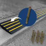 A kerb ramp with black and yellow stripes on a pavement with an inset circle focusing on a single galvanised M10 anchor bolt, showing how it is used for securing the ramp.