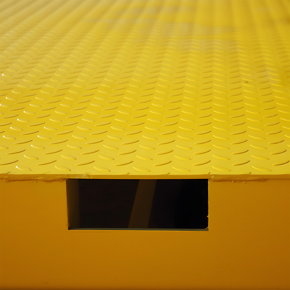 Close-up of the ramp surface, emphasising the textured anti-slip pattern and one of the forklift pocket openings