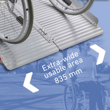 Extra-wide usable area of 835 mm highlighted on an aluminium wheelchair ramp, with a close-up of wheelchair wheels on the ramp