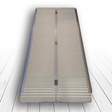 Single-fold heavy-duty aluminium ramp laid flat on a textured surface, displaying the ramp's width and supportive hinge