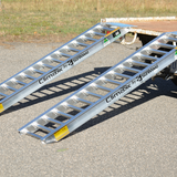 gravel ground and the Sureweld 1.5-Tonne 2.4m x 390mm Rubber Series Aluminium Loading Ramps