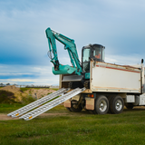 excavator on the rear of the truck descending 