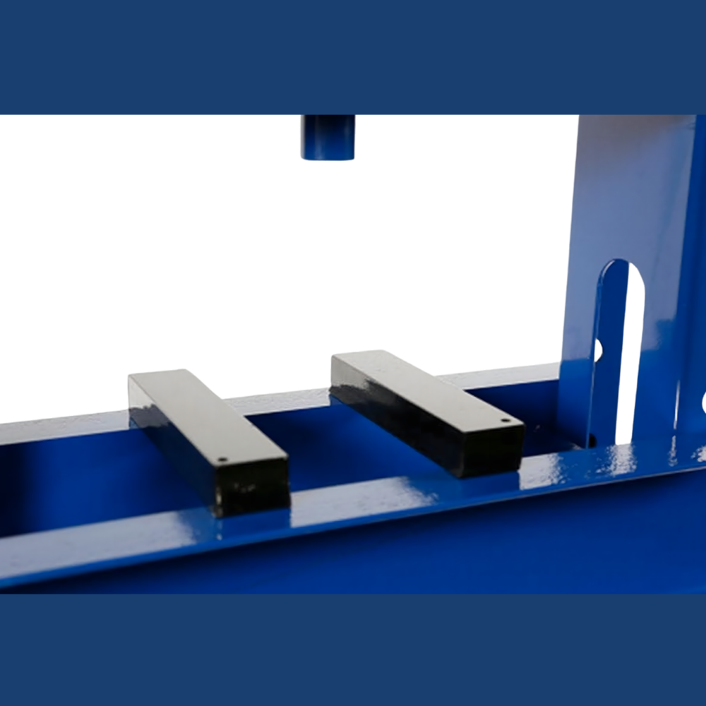 A close-up view of the frame of the hydraulic press. The image highlights the thick blue steel construction and perforations in the frame, which allow for adjustable configurations or bolting.