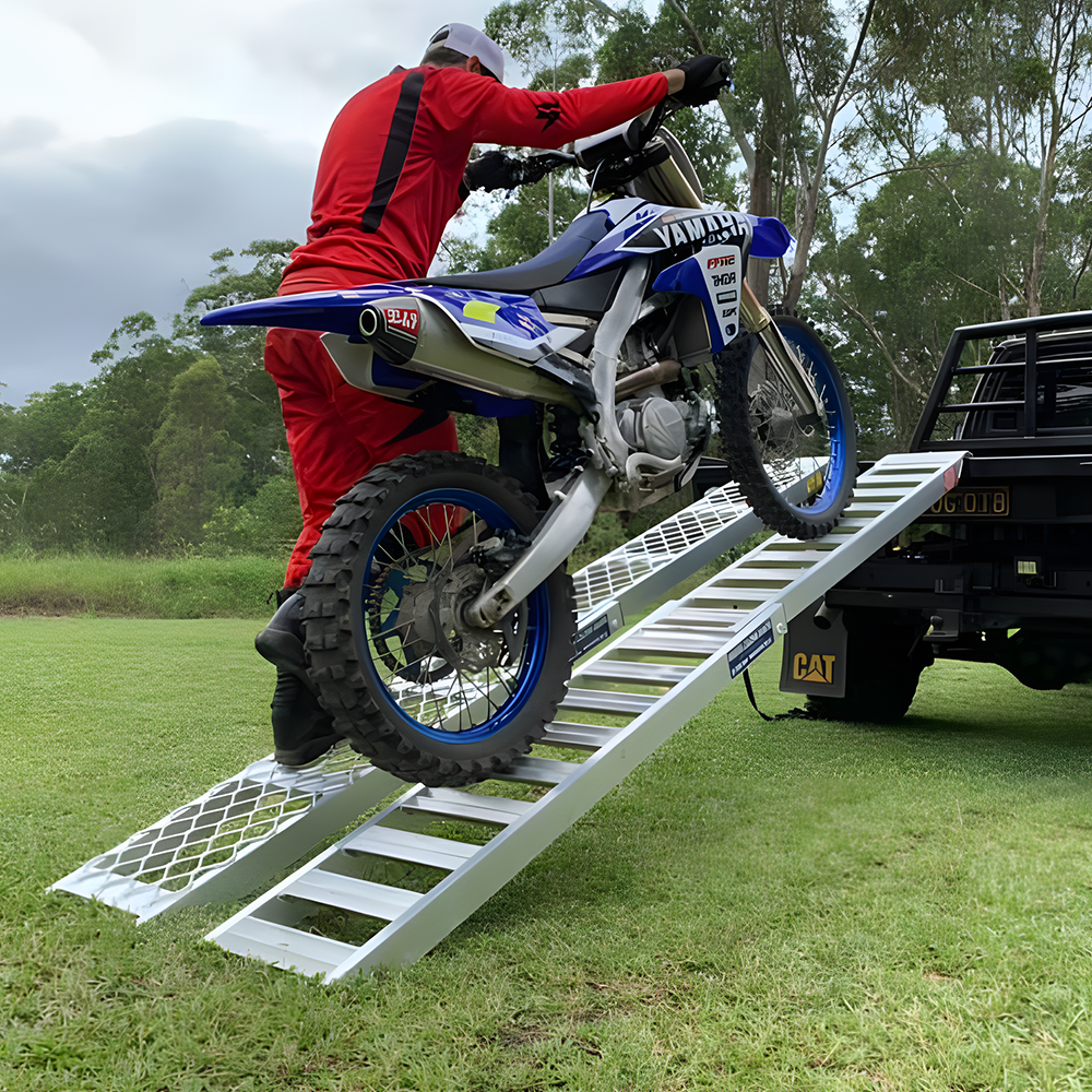 rider moving his motorcycle using Whipps 200kg Non-Folding Aluminium Motorcyle Side-Walk Ramp