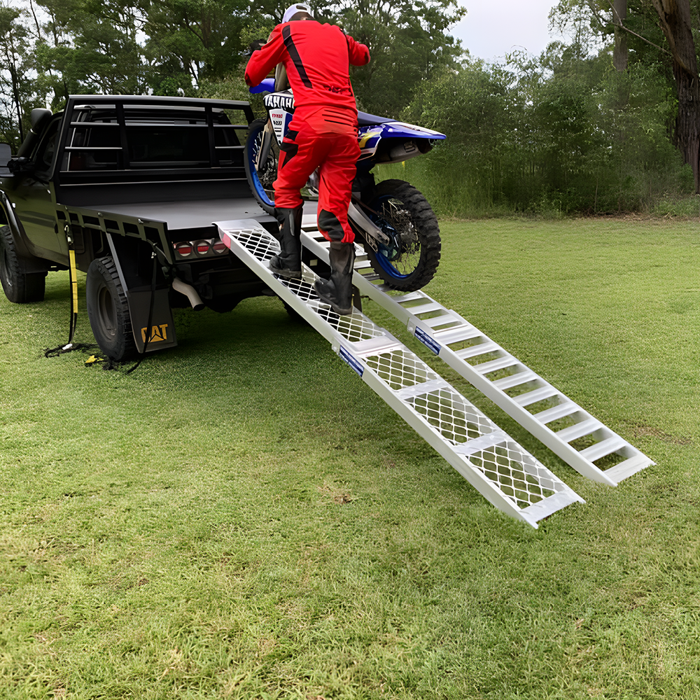 rider moving his motorcycle using Whipps 200kg Non-Folding Aluminium Motorcyle Side-Walk Ramp